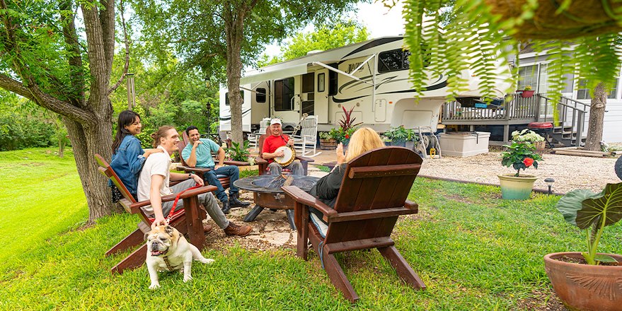Family sitting around campfire