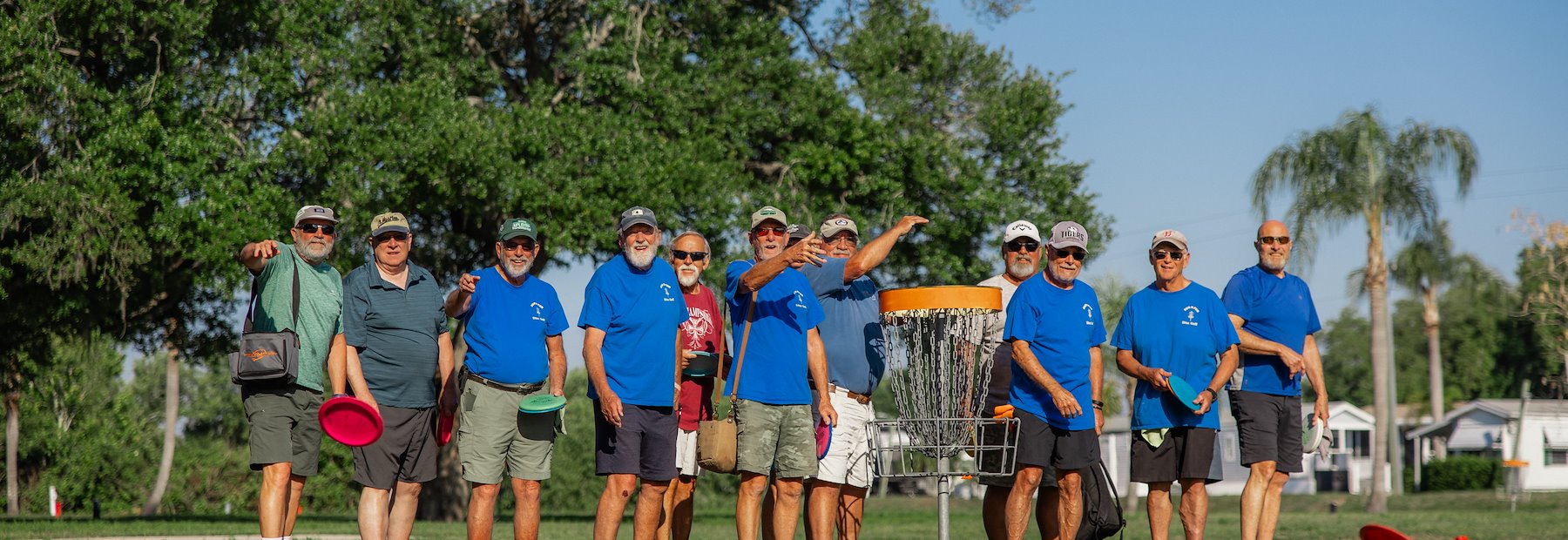 Group of men playing disc golf